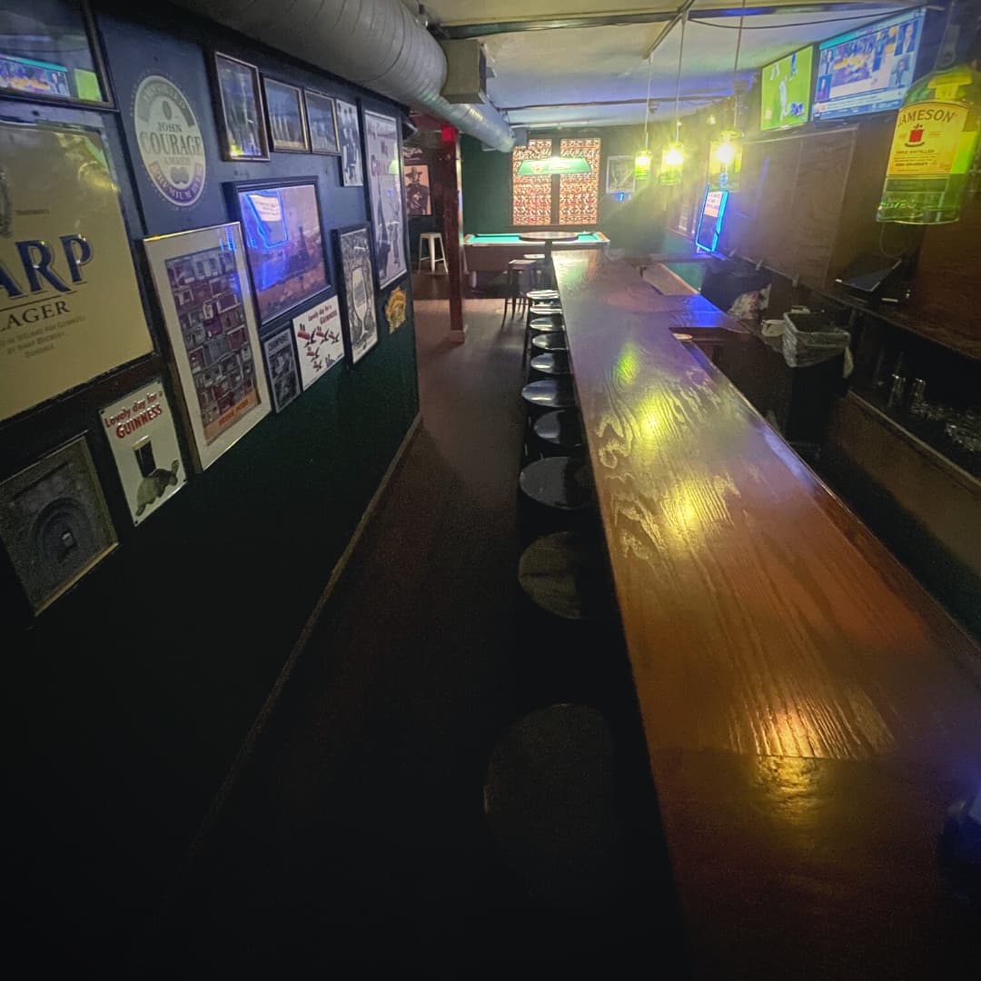The upstairs bar with frames on the wall