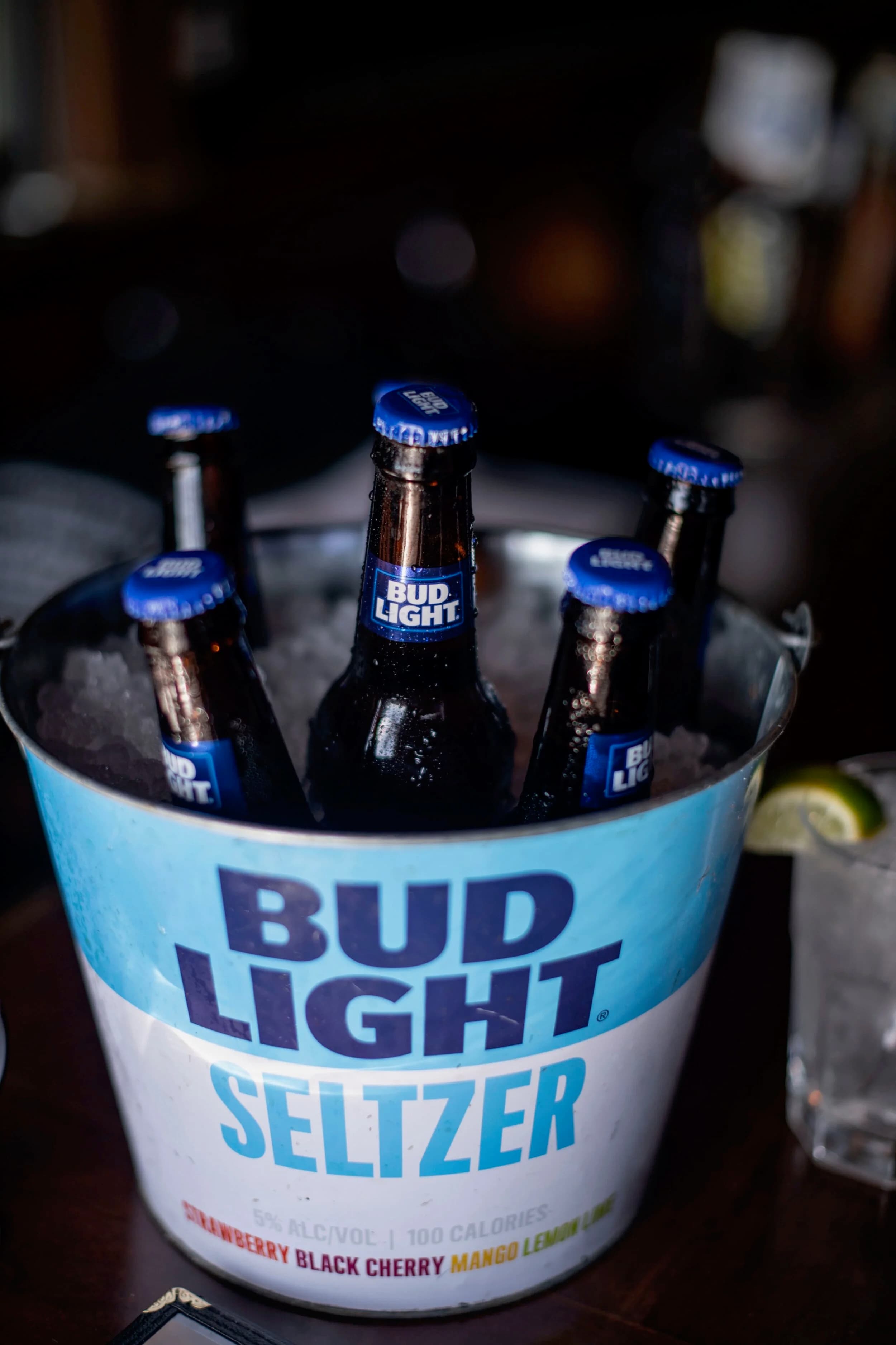 A bucket of domestic bottles on ice