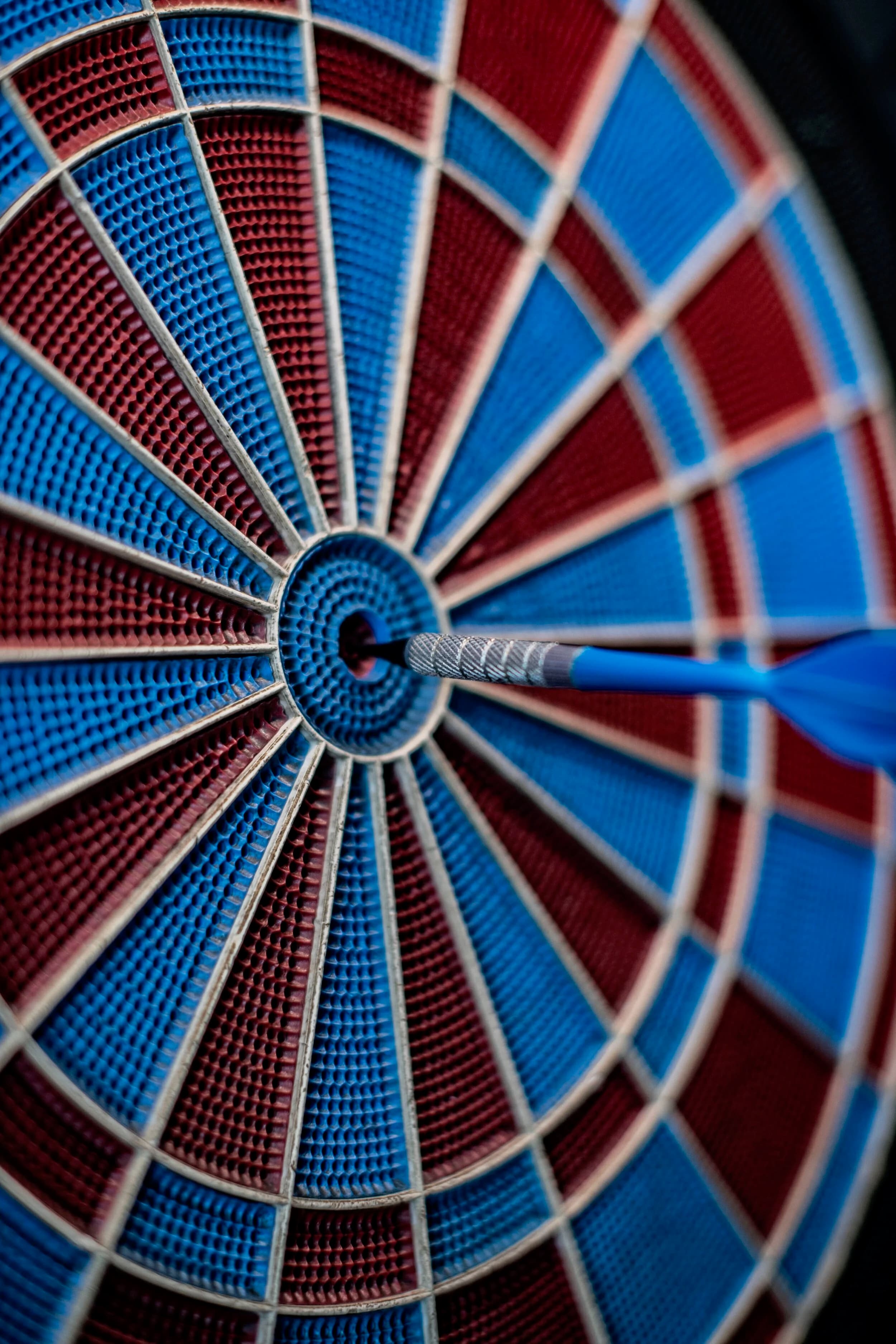 A dart landing in the bullseye