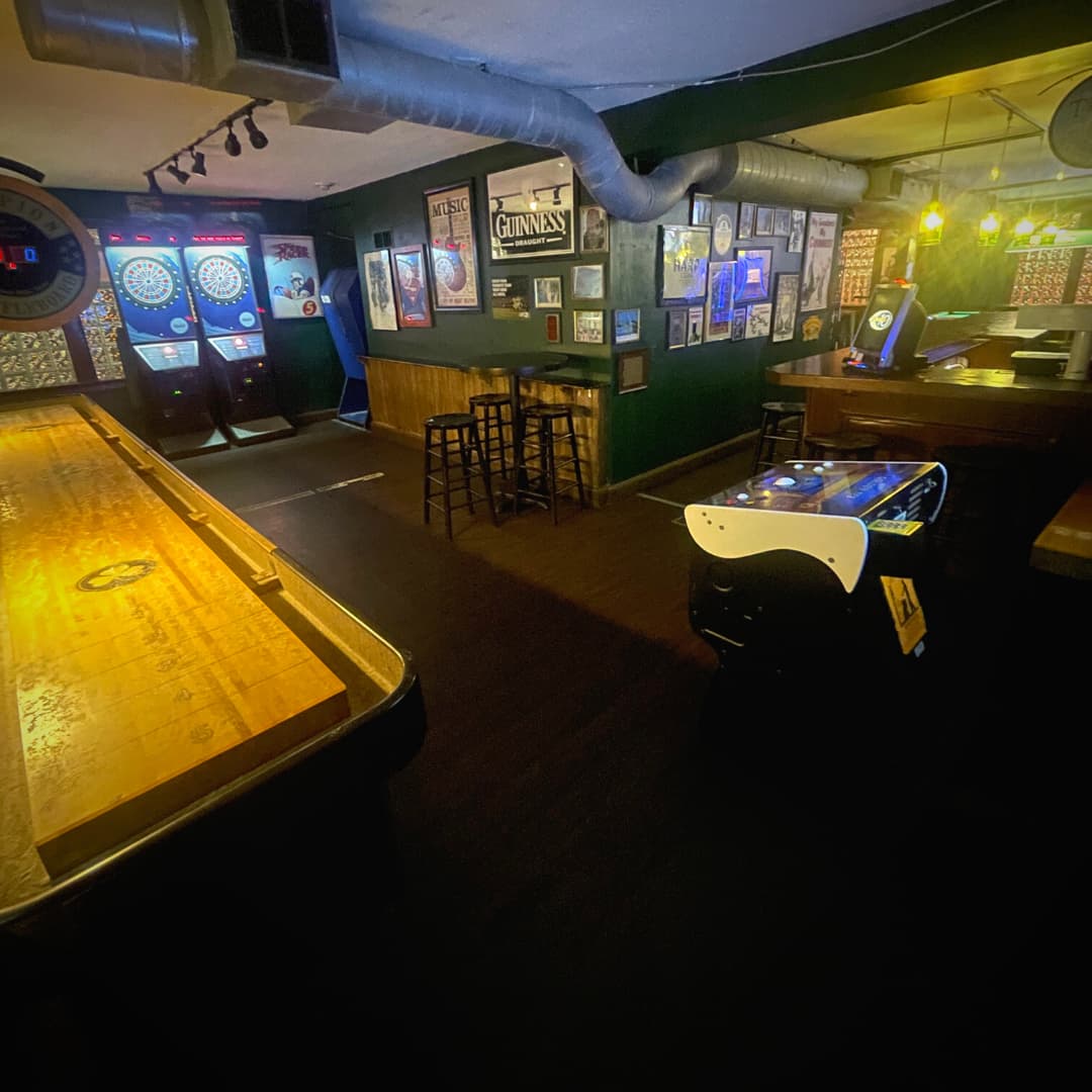 Shuffleboard area of the upstairs game room
