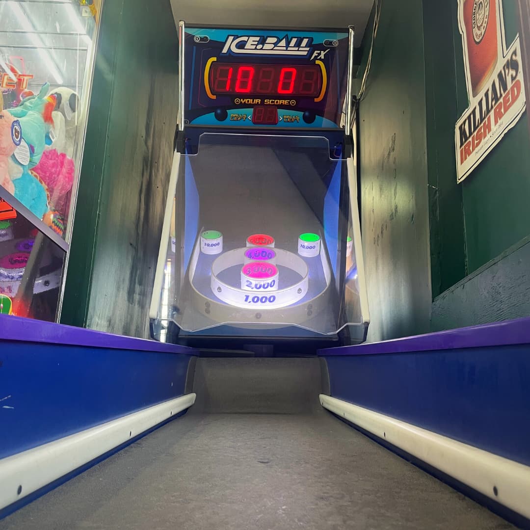 Skee-ball lanes lit up in the game room